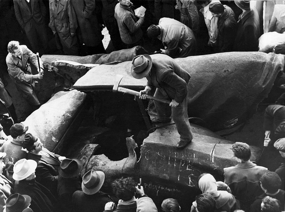 Giant statue of Stalin is chopped to pieces – near the National Theatre Budapest, 1956.