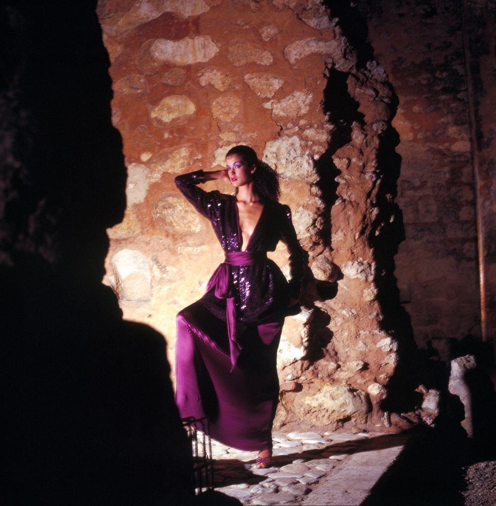 #24 Janice Dickinson wearing a purple sequin top and long purple skirt, 1979.