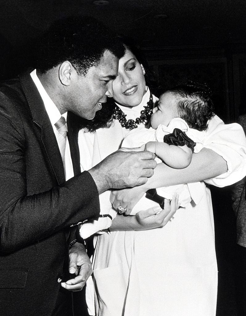 #32 Jayne Kennedy with Muhammad Ali and a child during Press Conference For Children’s Peace Foundation, 1986.