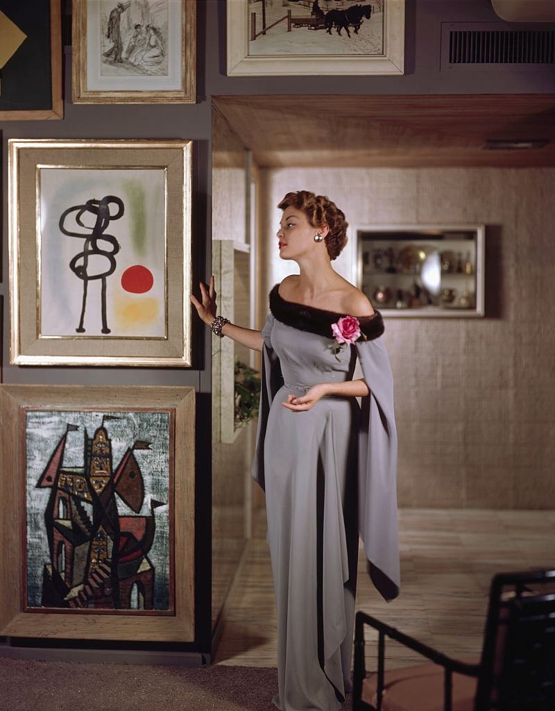#1 Jean Pachett models a dress by Netti Rosenstein in the art-filled apartment of Raymond Loewy, 1950.