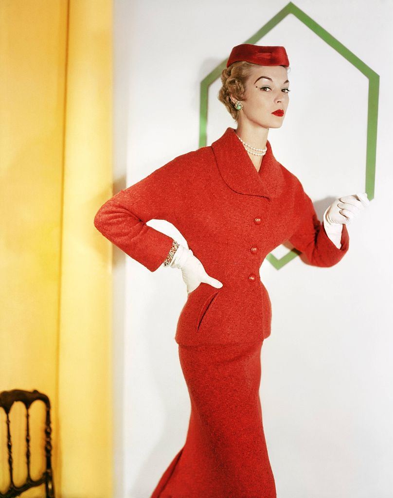 #28 Jean Patchet in a orange tweed (a lesur fabric) suit, matching velvet hat, 1953.
