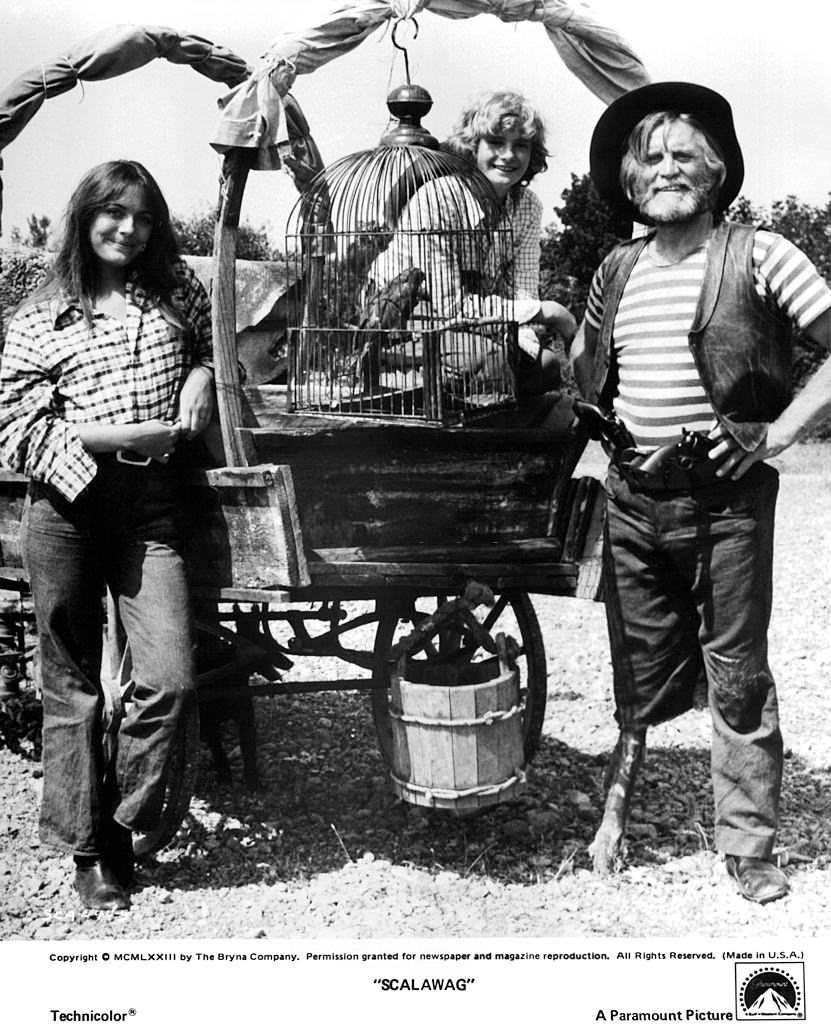 #20 Lesley-Anne Down with actors Mark Lester and Kirk Douglas on set of the Paramount Pictures movie “Scalawag” in 1973.