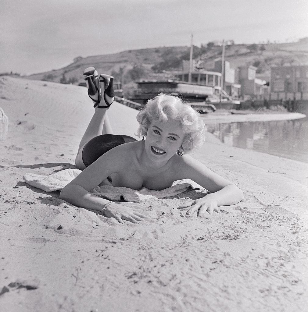 #70 Mamie Van Doren enjoying on the Beach, 1953.