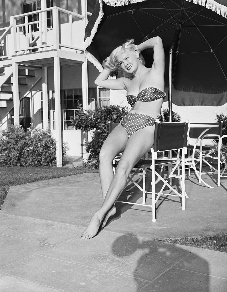 #74 Mamie Van Doren in a bathing suit at California beach, 1953.
