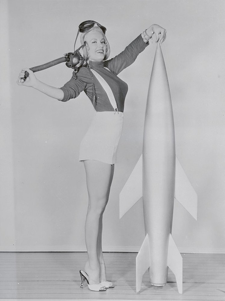 #22 Mamie Van Doren Standing by Mock Rocket, 1955.