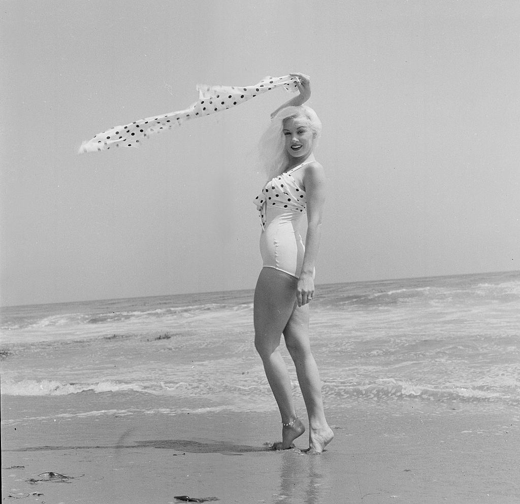 #37 Mamie Van Doren enjoying on the beach, 1956.