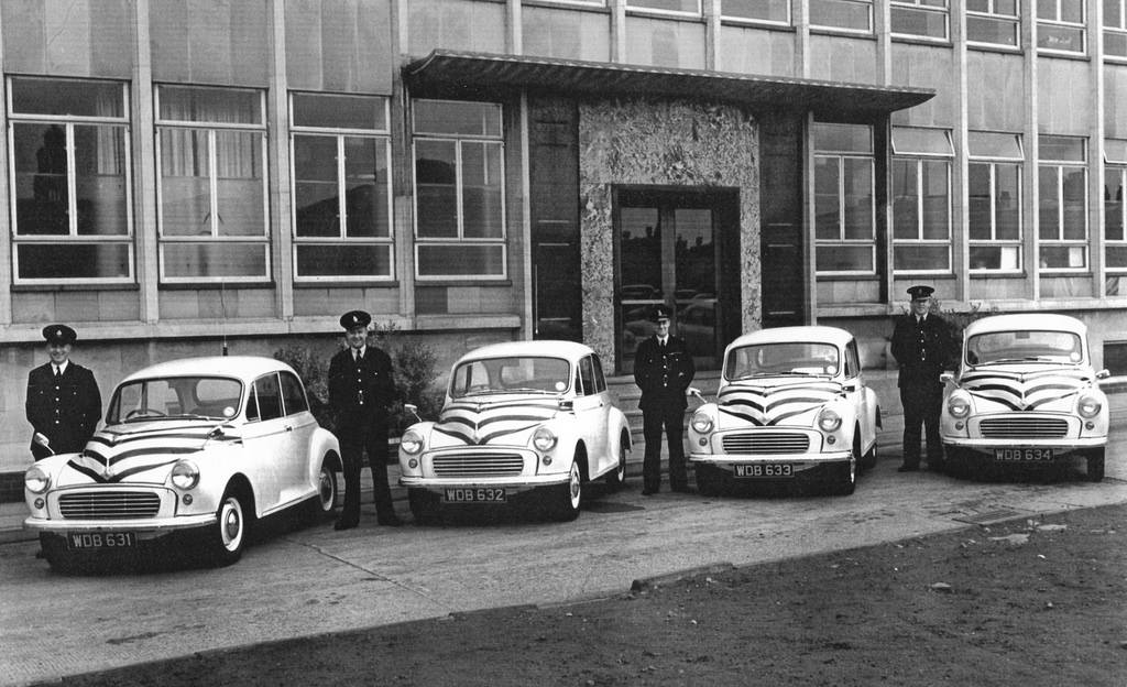 #12 Stockport Borough Police officers stand proudly beside their Morris Minor 1000s outside the force’s headquarters on the town’s Lee Street in the late 1950s