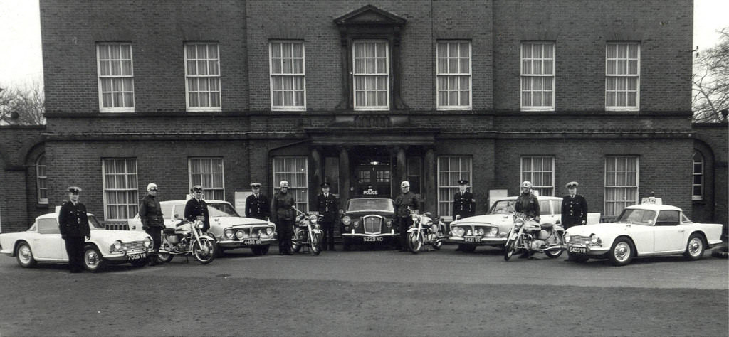 #33 Manchester City Police officers pose proudly with some of the force’s vehicles outside Platt Hall in the city’s Platt Fields Park, 1961.