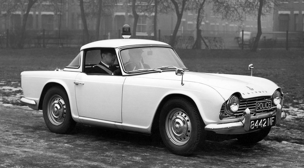 #34 A classic Triumph police car in a Manchester park on an icy day in 1962