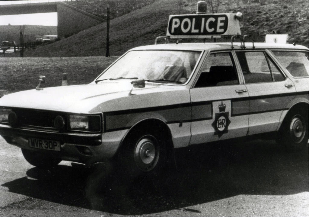 #42 A Ford Granada of Greater Manchester Police’s Motorway Unit sits beside the carriageway in the mid to late 1970s