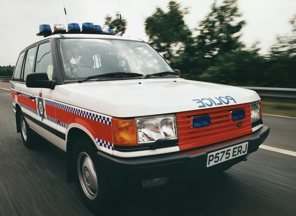 #68 A Greater Manchester Police Motorway Unit Range Rover is at speed during the mid 1990s
