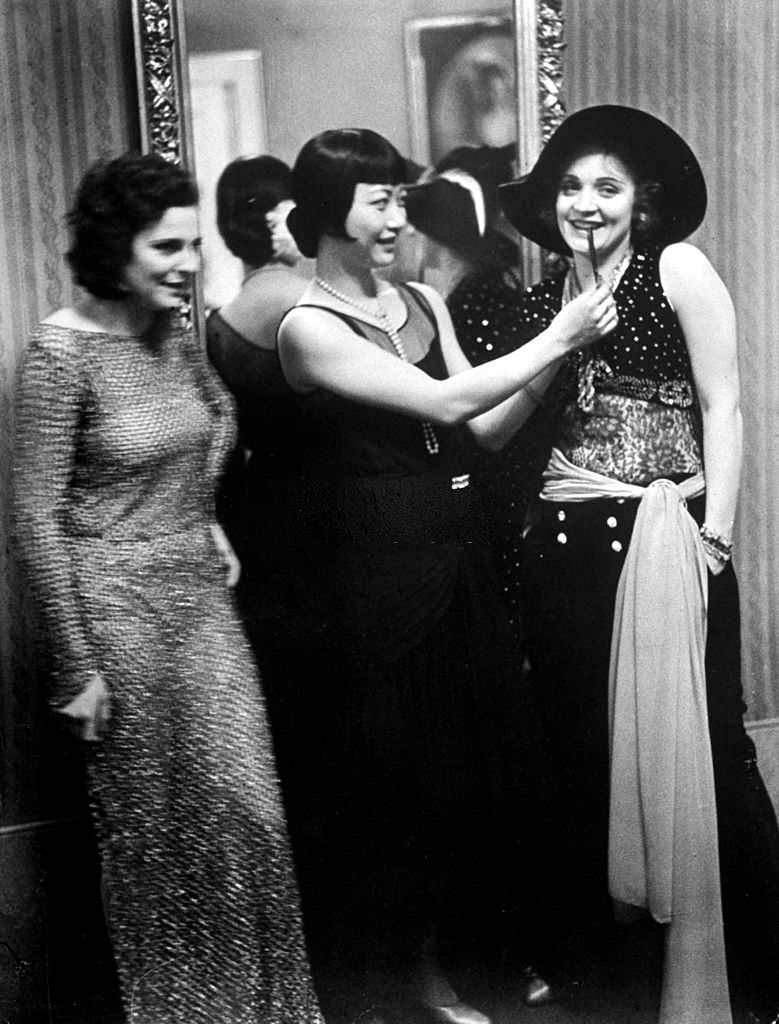 #51 Marlene Dietrich with leni Riefenstahl and Anna May at Pierre Ball, 1928.