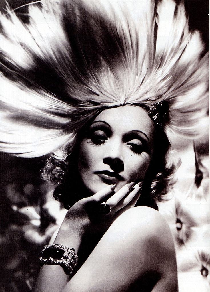 #9 Marlene Dietrich wearing an exotic headdress designed by Travis Banton for the film ‘Angel’, 1930.