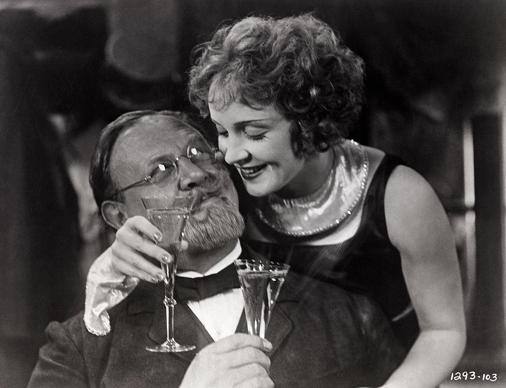#17 Marlene Dietrich leans over Emil Jannings, 1930.
