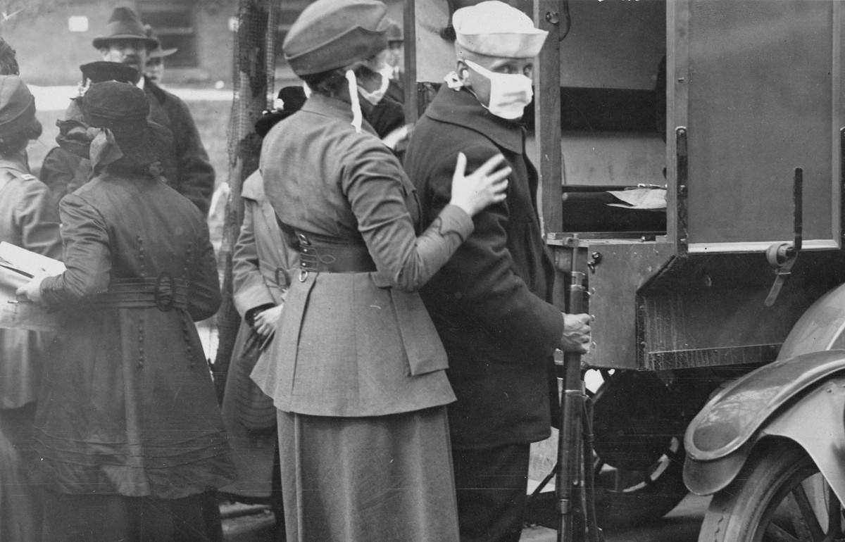 #15 A sailor and a member of the Women’s Motor Corps wear masks while treating influenza patients injured by the explosions of a coal loading plant at Morgan, New Jersey, on October 5, 1918