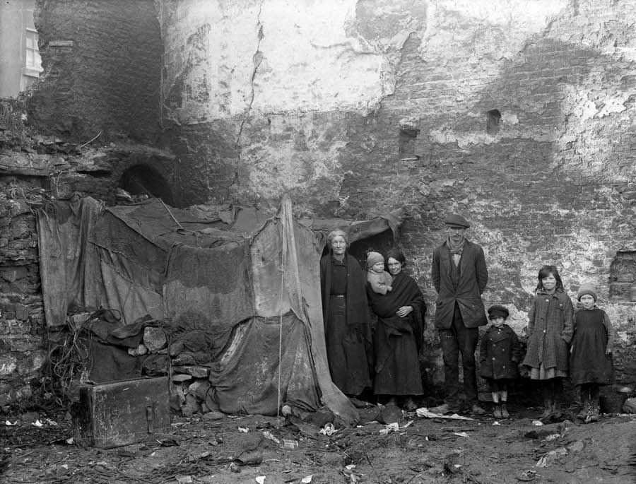 #15 Three generations of a family pose beside their home at Alexander Street, Waterford, 1924.