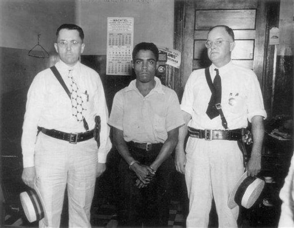 #3 Rainey Bethea with Sheriff’s Deputies Albert Riesz and Lawrence Dishman as they leave the Jefferson County jail in Louisville, Kentucky for his execution in Owensboro, Kentucky.