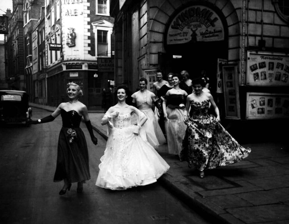 #4 The Windmill girls dash across London’s Soho to a party in 1953.