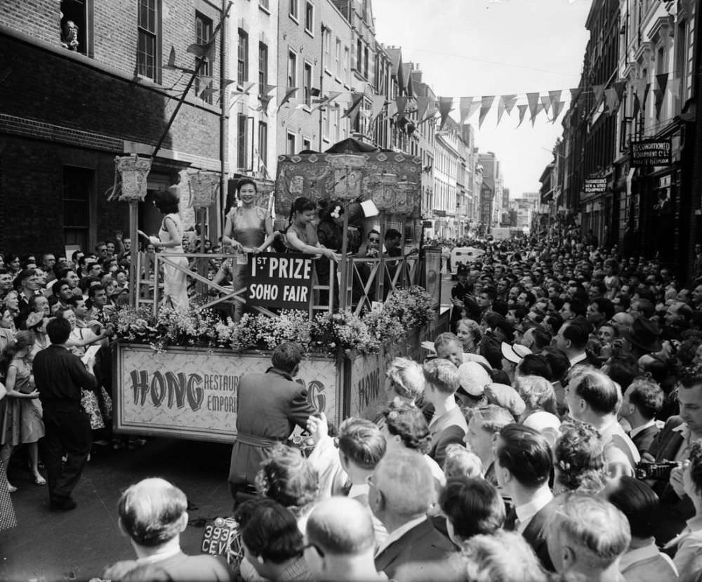 #5 The first prizewinning tableau on parade through the streets of Soho, London, at the opening of the Soho Fair in 1955.