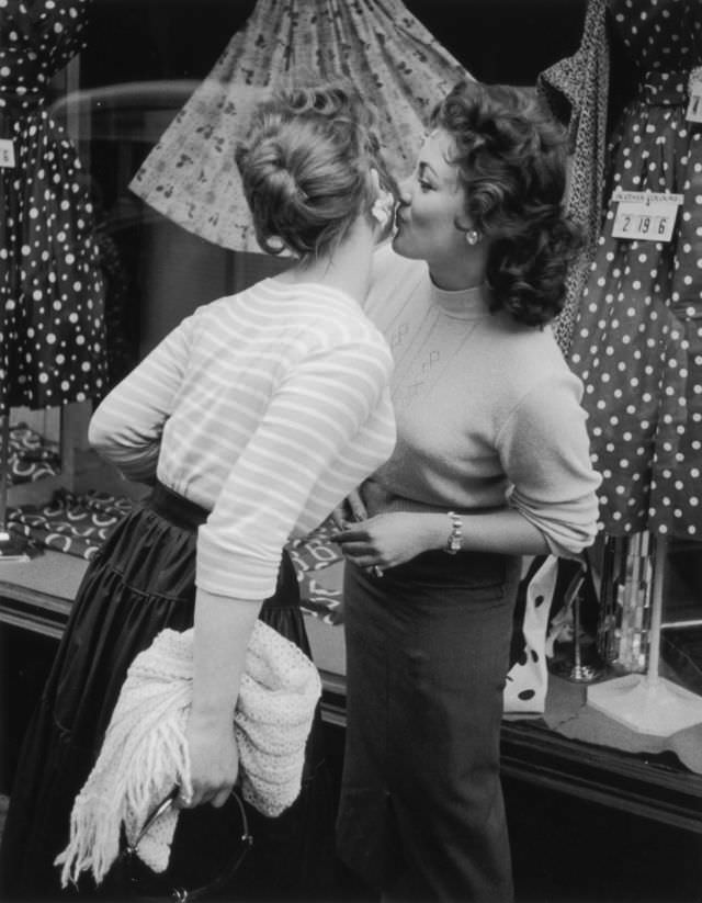 #21 Young girls greeting each other, 1956.