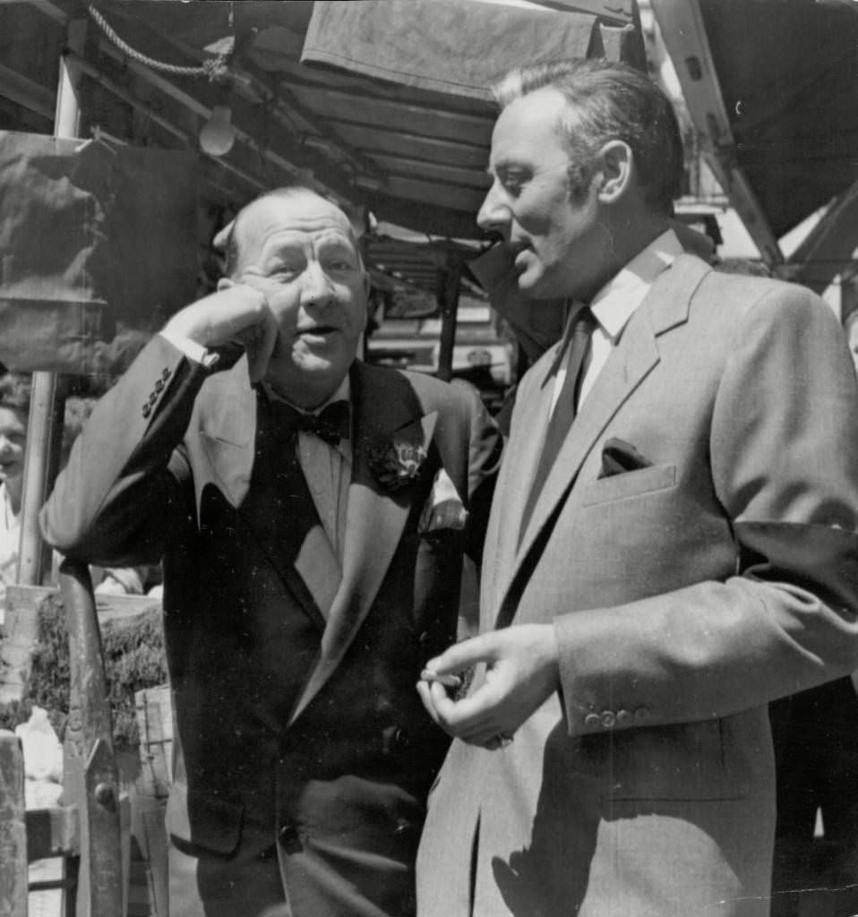#30 Noel Coward chats With Michael Wilding In Soho’s Berwick Market