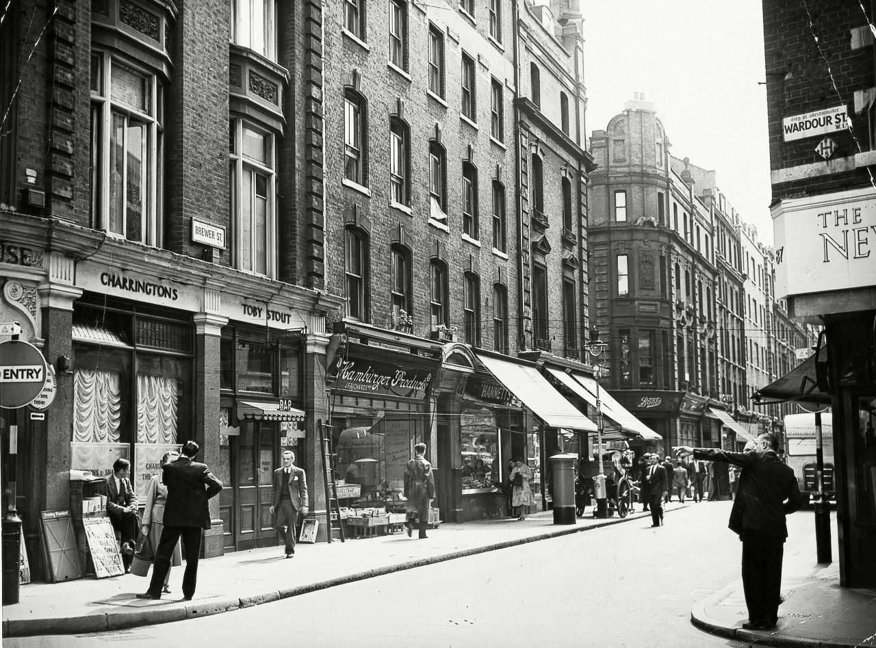 #34 Brewer Street and the corner of Wardour Street in Soho, London, 29 Jul 1956.