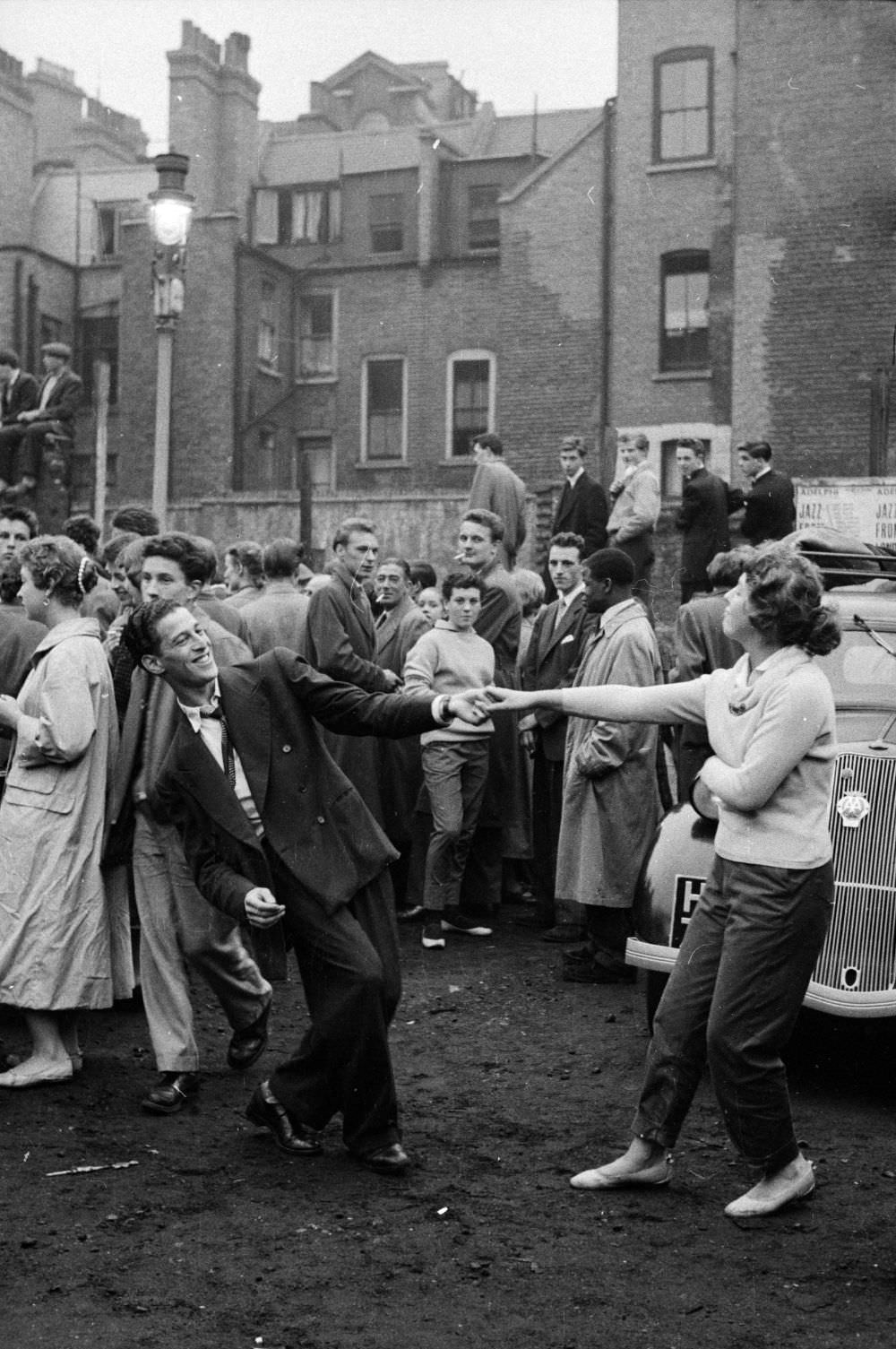 #1 London’s youth hang out on the streets of Soho in 1956.