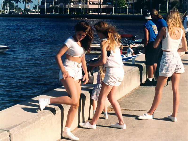 #33 Three young women taking a break at the festival at the West Palm Beach waterfront on a warm day, 1992