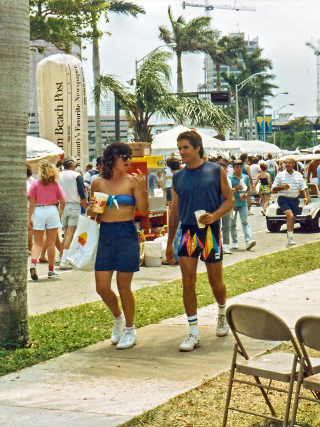 #8 The couple walks by on a sidewalk, SunFest, 1988