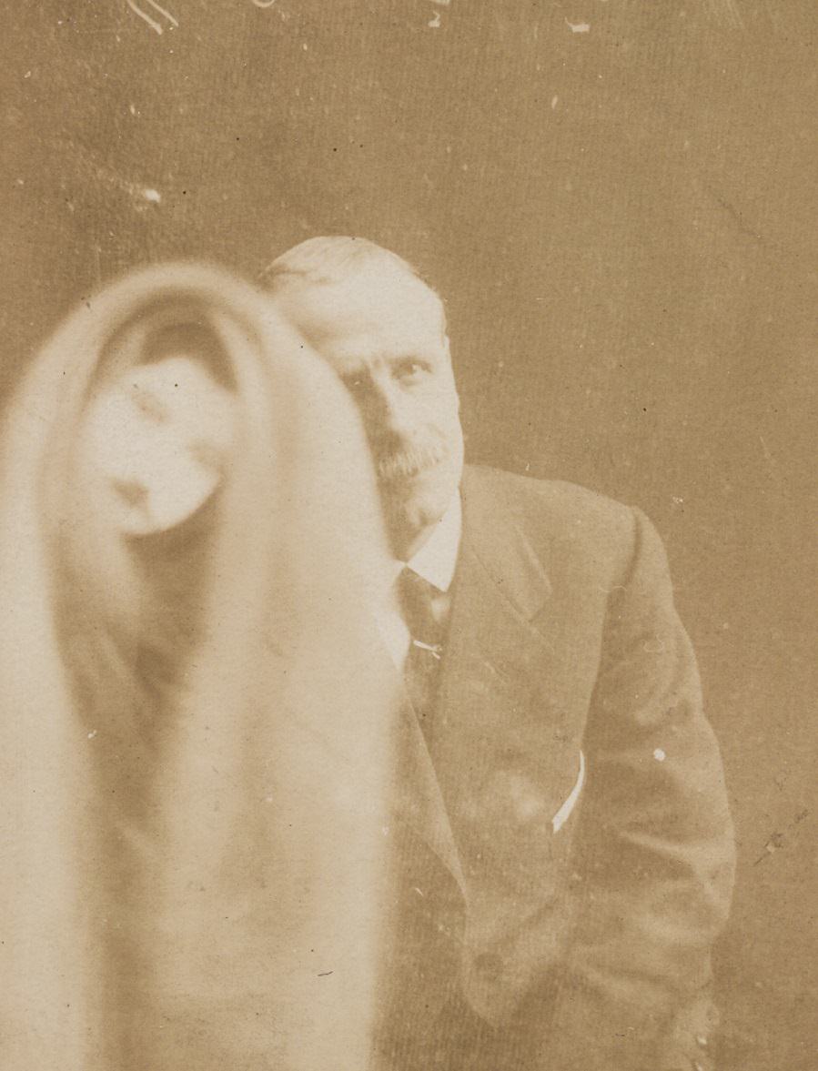 #10 The alleged face of a long-dead work colleague appears over a portrait of a man.
