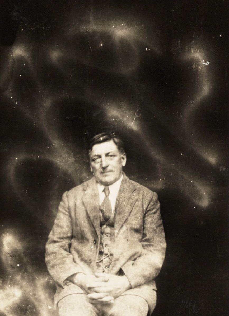 #9 A man is surrounded by swirls of light meant to be the presence of spirits.