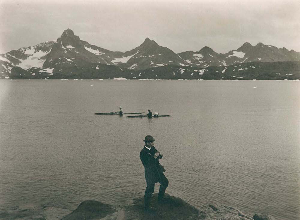 #24 A self-portrait of photographer T.N. Krabbe standing over Tasiusaq Bay, 1890s
