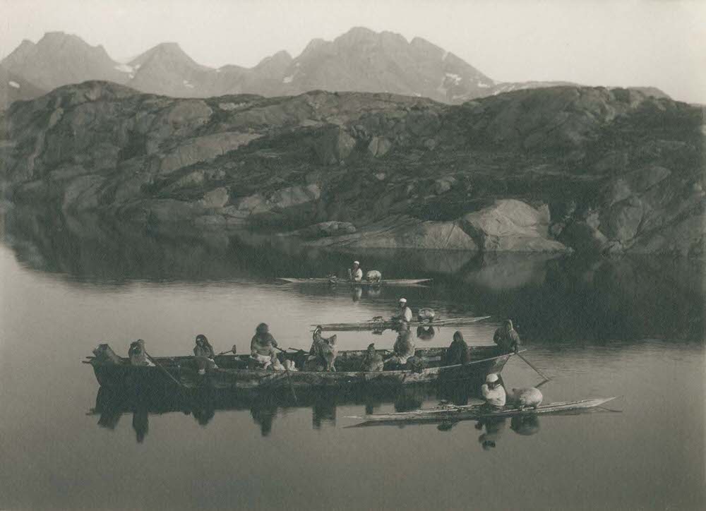#6 A boat and kayakers near Ammassalik, 1890s