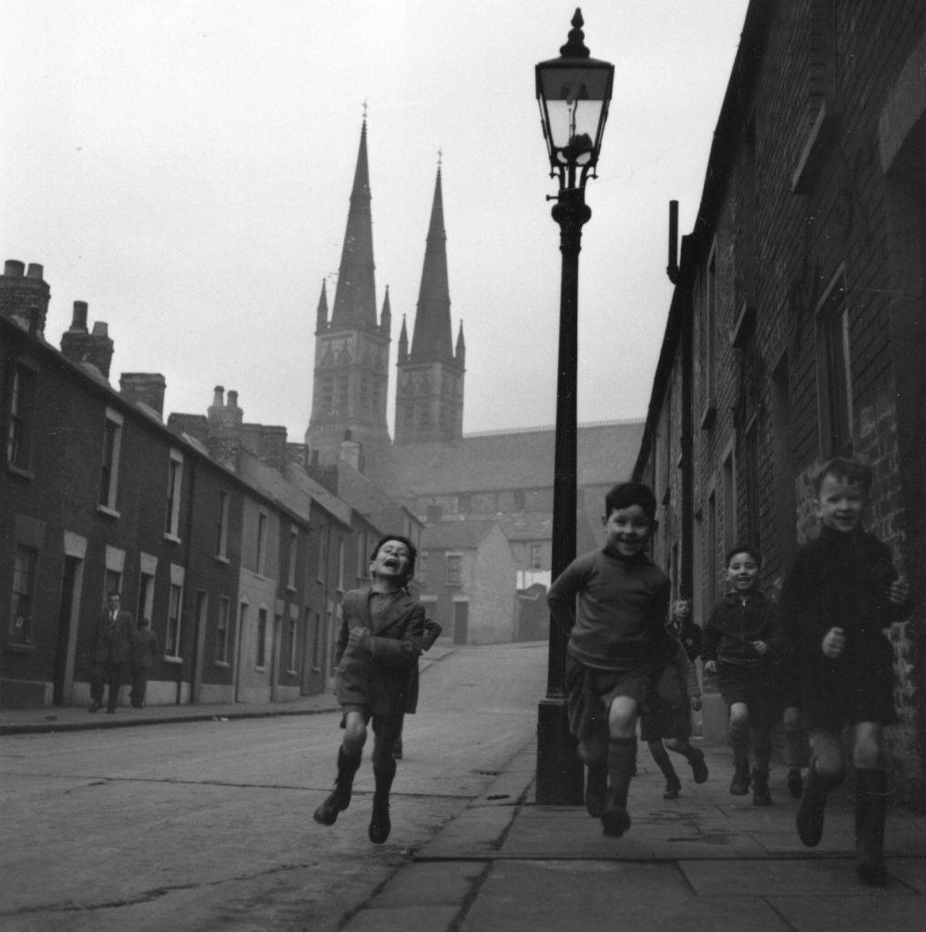 #5 Kids running through the streets of Belfast, 1954.