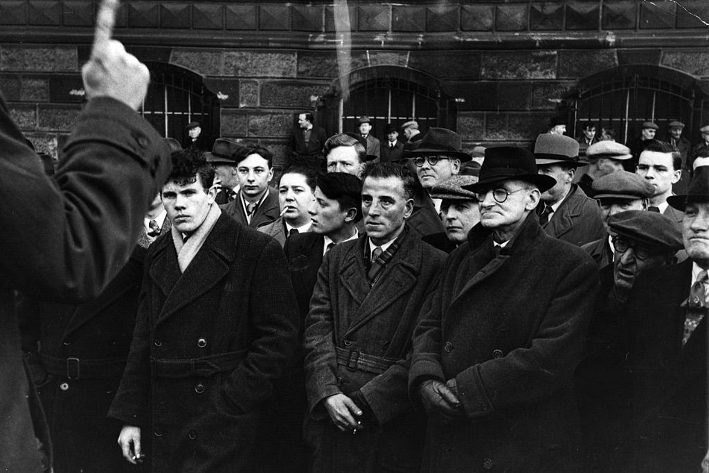 #24 A crowd of working men listen to Sunday afternoon speakers on religion at the Customs House, Belfast, 1954.