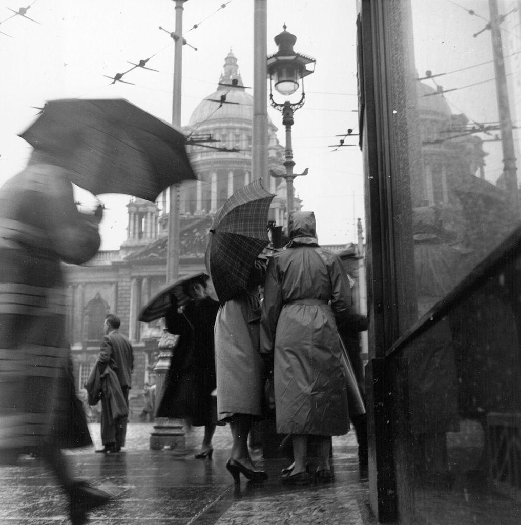#6 People in Belfast on a rainy day, 1954.