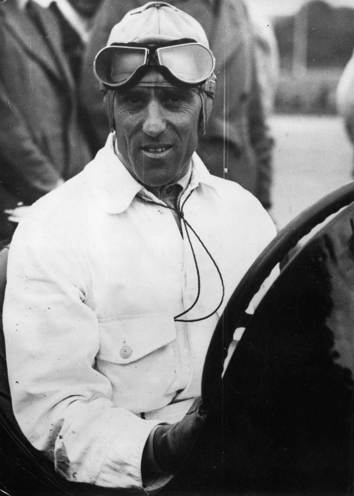 #10 Tazio Nuvolari also know as Il Campionissimo (The Great Little Man) being congratulated by his wife on his win in an Ulster TT car race held in Belfast, 1950.