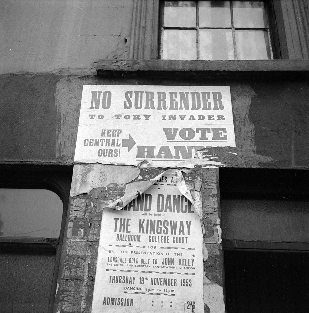 #56 An election poster on a wall in Belfast, 1954.