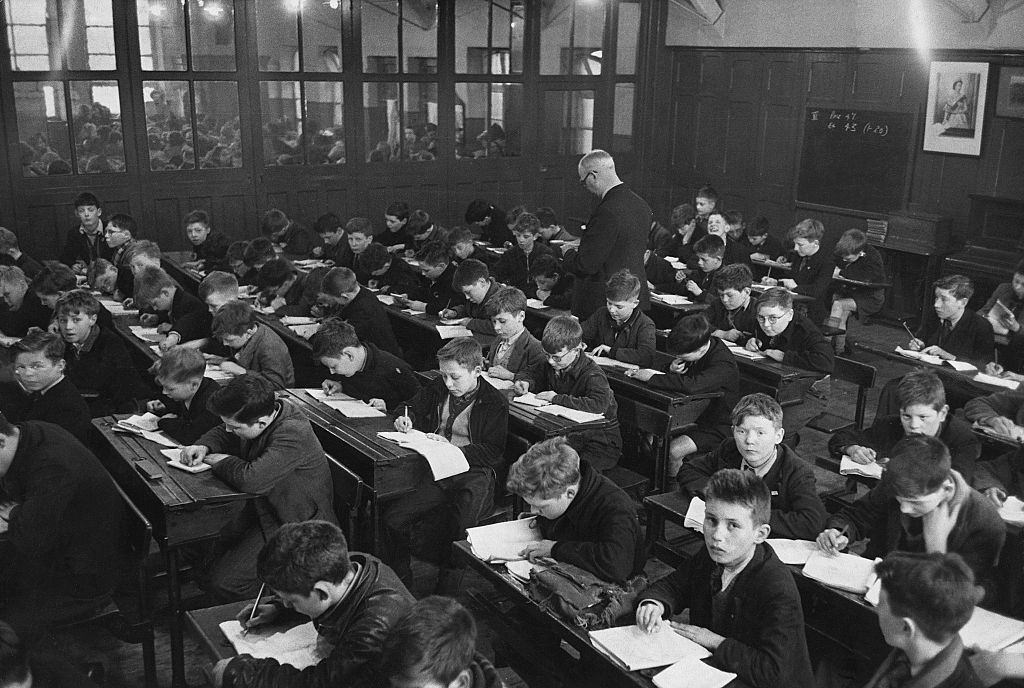 #62 Students in study in an overcrowded classroom in Belfast, 1954.