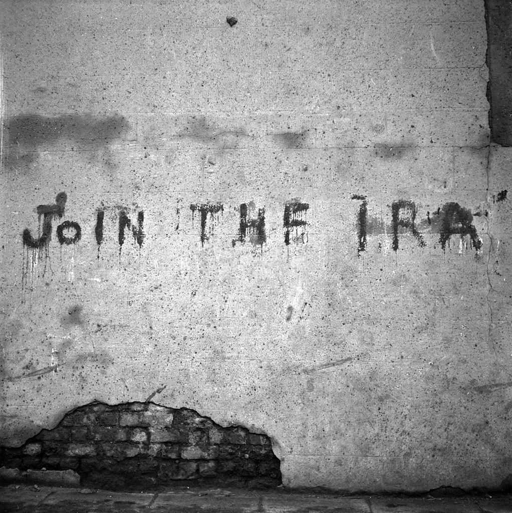 #41 A spray painted message on a wall in Belfast reading ‘Join The IRA’, 1954.