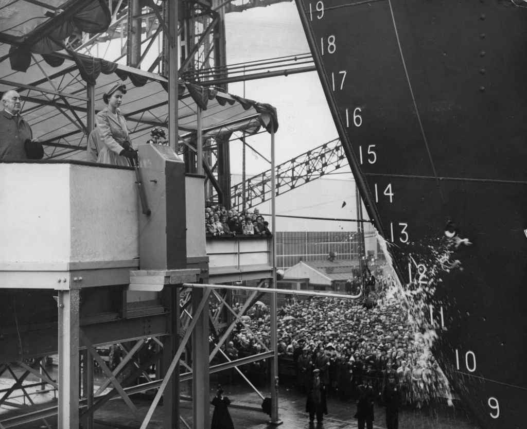 #42 A bottle of Empire champagne shatters against the new Shaw Savill liner Southern Cross at the launch by Queen Elizabeth II, 1954.