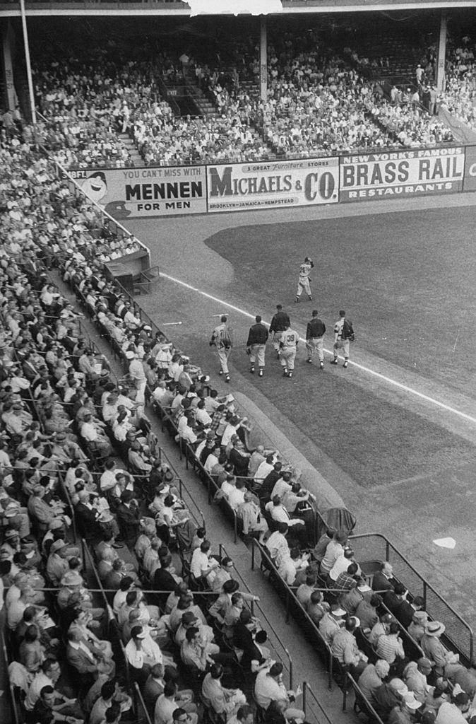 #19 Fans watching a game between the Milwaukee Braves and the Brooklyn Dodgers at Ebbet’s Field.