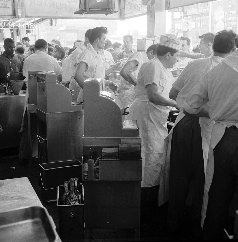 #23 The cash registers are busy at Nathan’s famous hotdog stand in Coney Island, New York City, 1955.