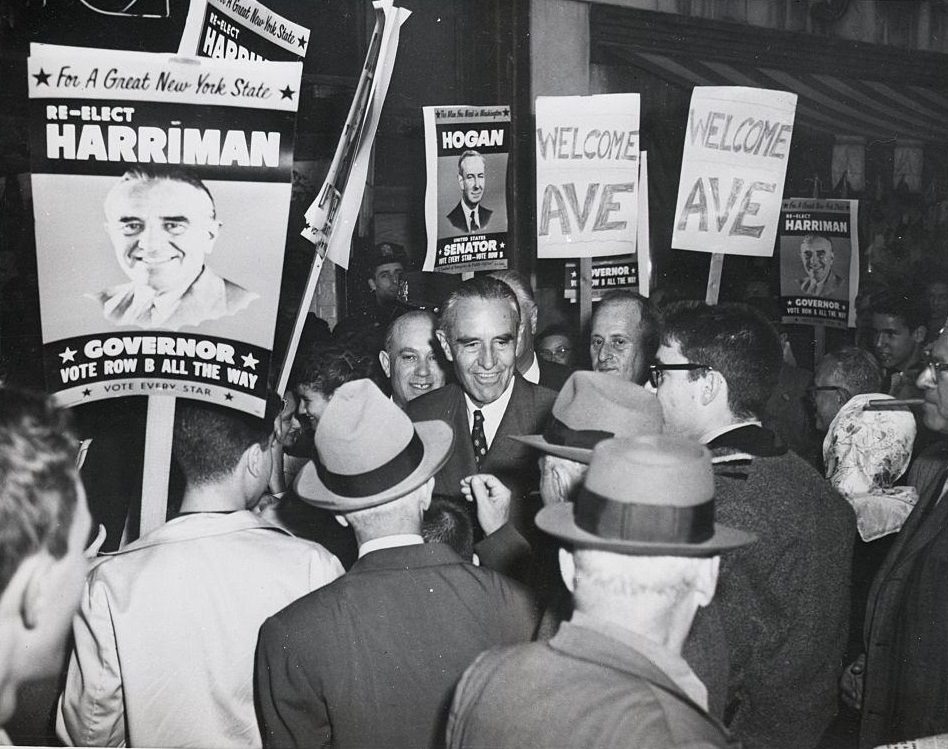 #29 New York Governor Averell Harriman is surrounded by crowds as he leaves a store in one of Brooklyn’s busiest shopping centers, 1958.