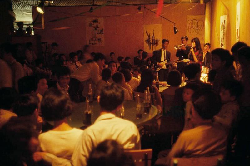 #6 A band entertains in a makeshift nightclub in Saigon, 1965