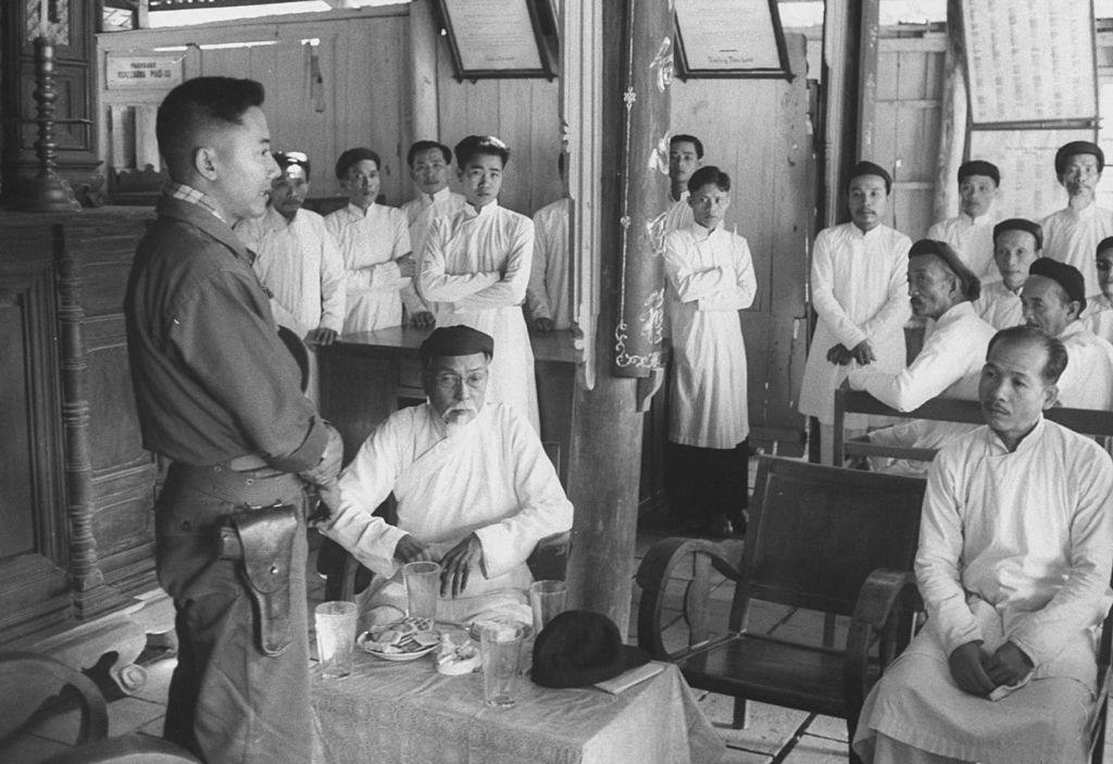 #25 Chief of Kien Hoa province Col. Ngoc Thao Pham visting temple, 1961.