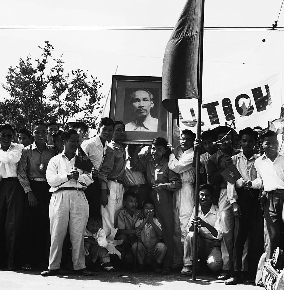 #5 A group of young men bear a portrait of Ho Chi Minh, 1960.