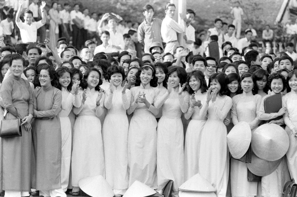 #48 People during the deposing of President Ngo Dinh Diem in Ho Chi Minh City, 1963.