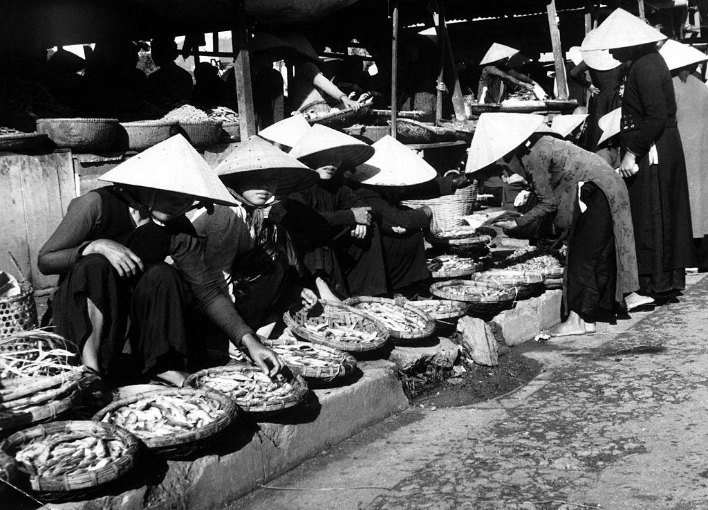 #6 A market-place in South Vietnam, at the junction between a small railroad track going from the South to the frontier, 1960.