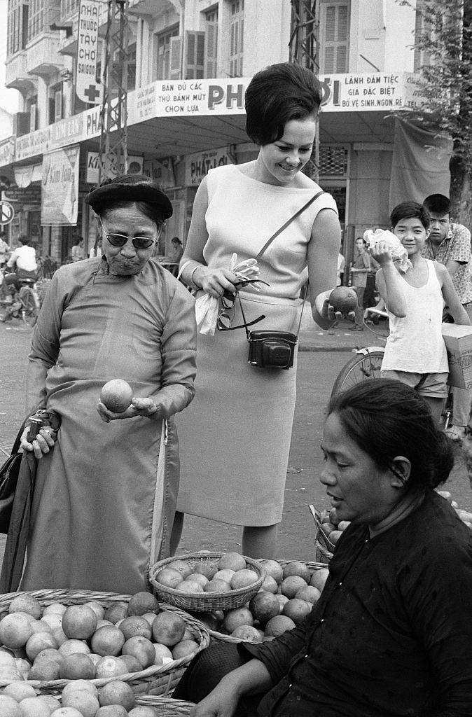#58 Ann Sidney (Miss world) Shopping at Market in Saigon, 1964.